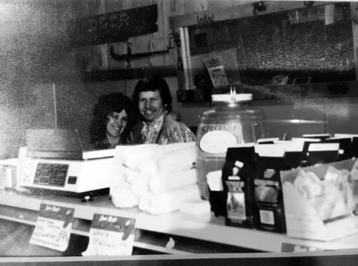 A black and white photograph from the market's early years, taken across the counter