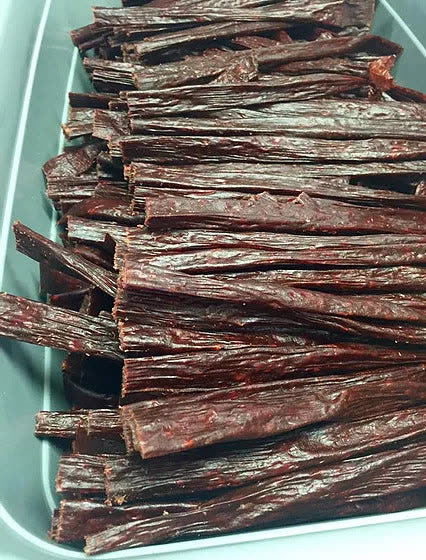A tray of house-made beef jerky strips