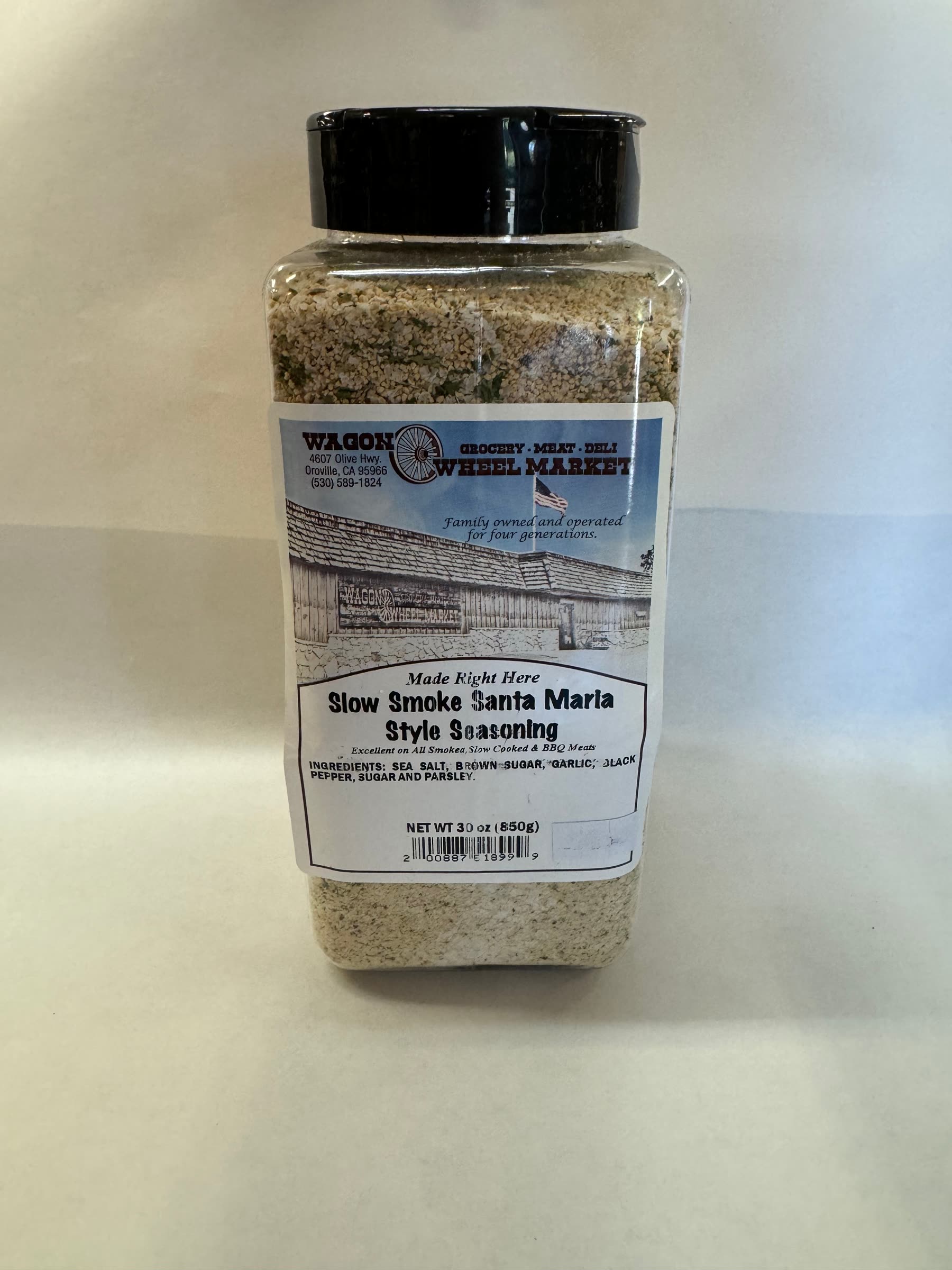 A 30oz shaker of Slow Smoke Santa Maria Style Seasoning made at the market